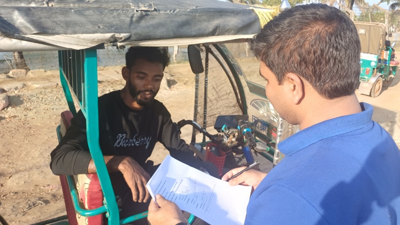 Nurul Hossain speaks to this reporter in his battery-powered auto-rickshaw in Chhanua village of Banshkhali, Chattogram, on February 1, 2026.